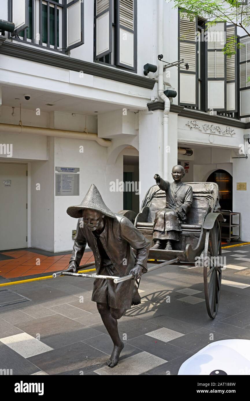 singapore, singapore - 2020.01.23: bronze sculpture of a rickshaw titled heading home at china square central telok ayer by lim leong seng Stock Photo
