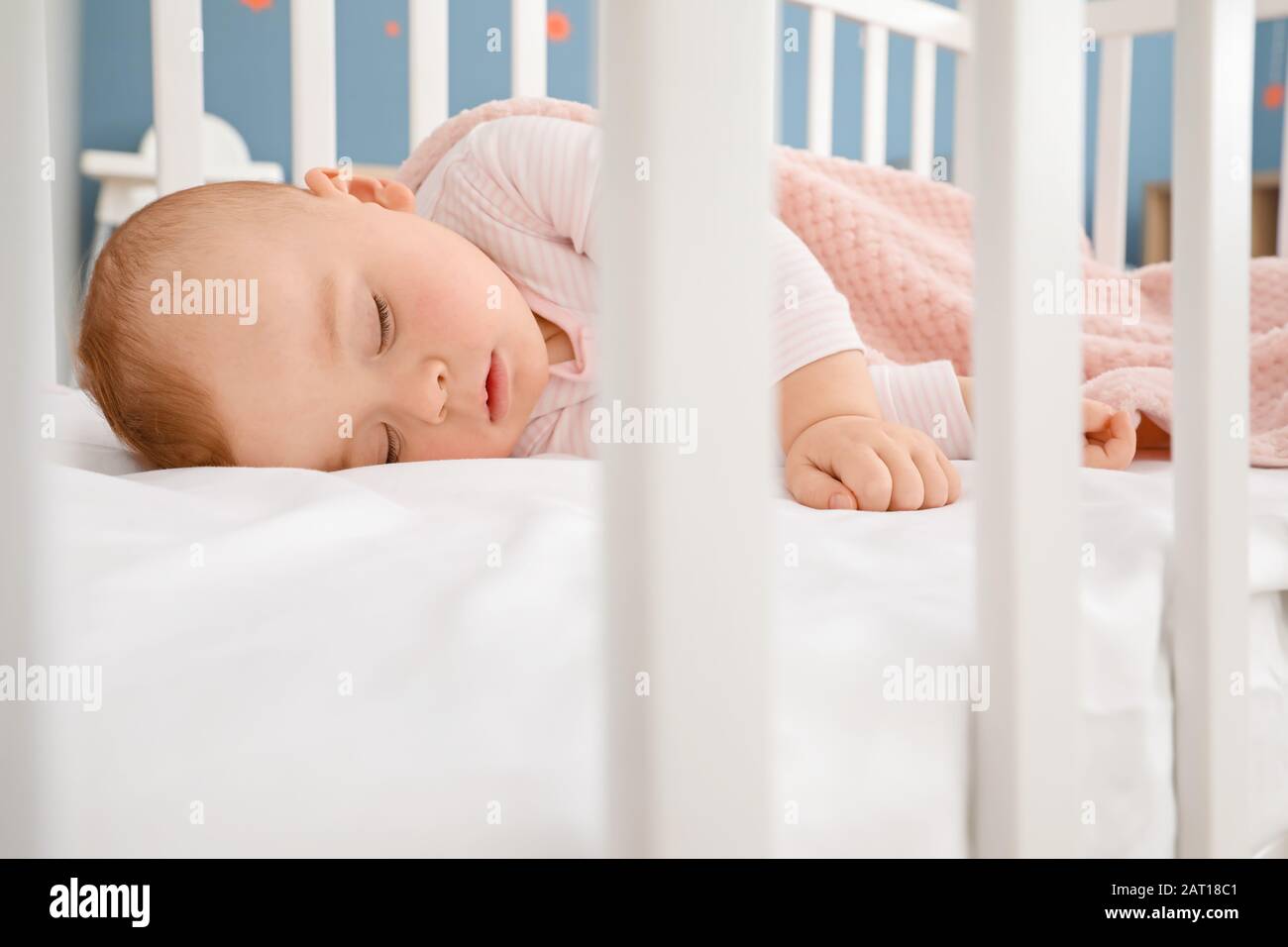 Cute sleeping little baby in bed Stock Photo - Alamy