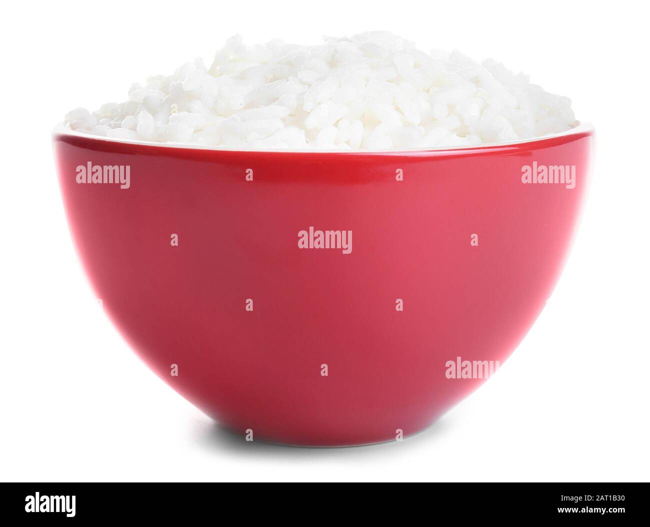 Boiled rice in bowl on white background Stock Photo - Alamy