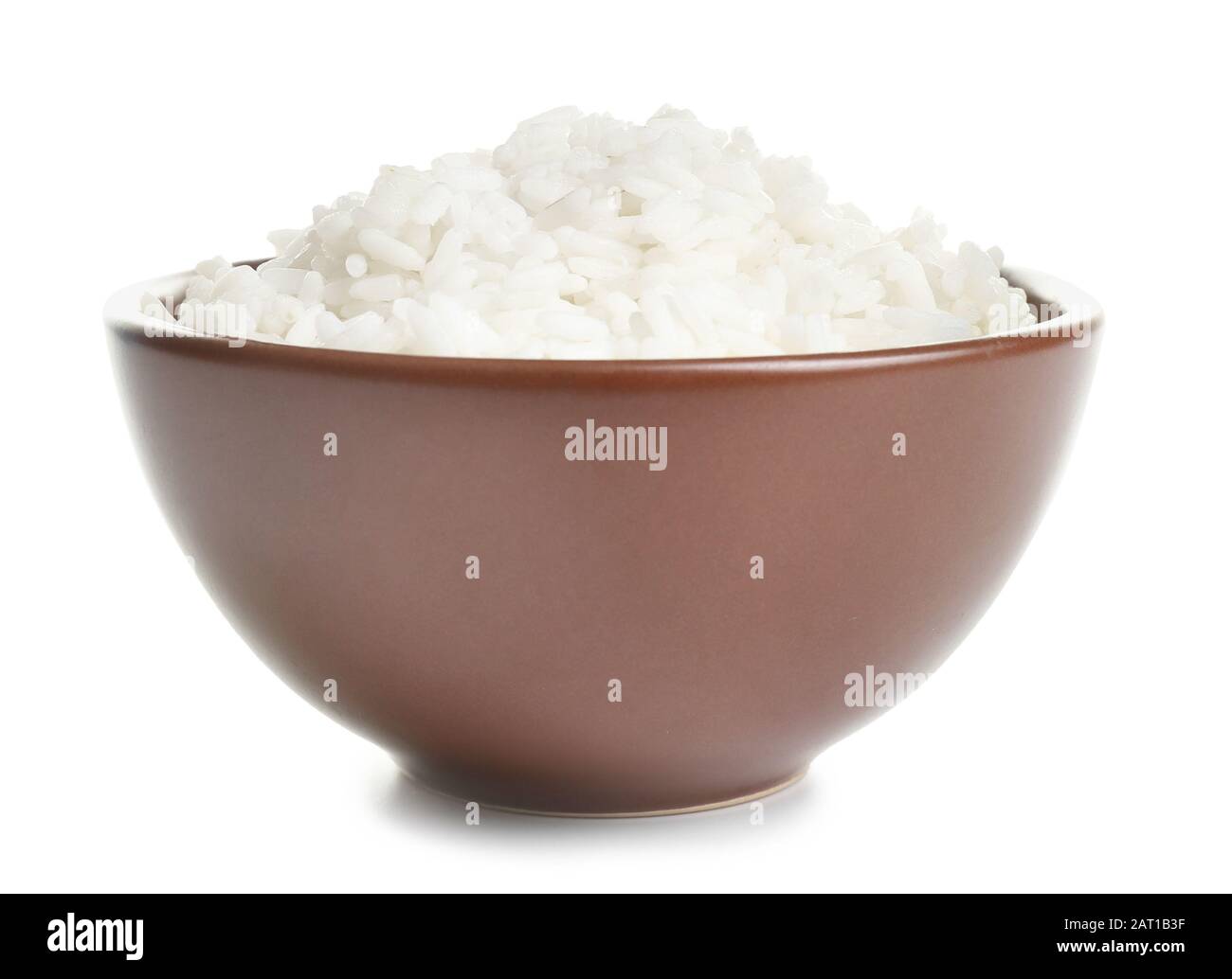 Boiled rice in bowl on white background Stock Photo - Alamy