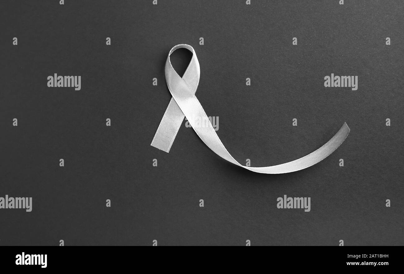 Silver ribbon on dark background Stock Photo Alamy