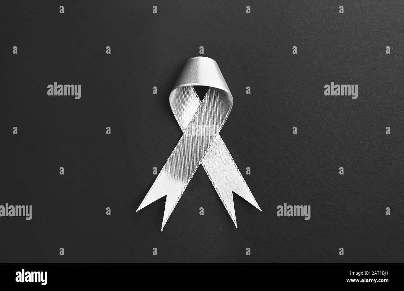 Silver ribbon on dark background Stock Photo Alamy