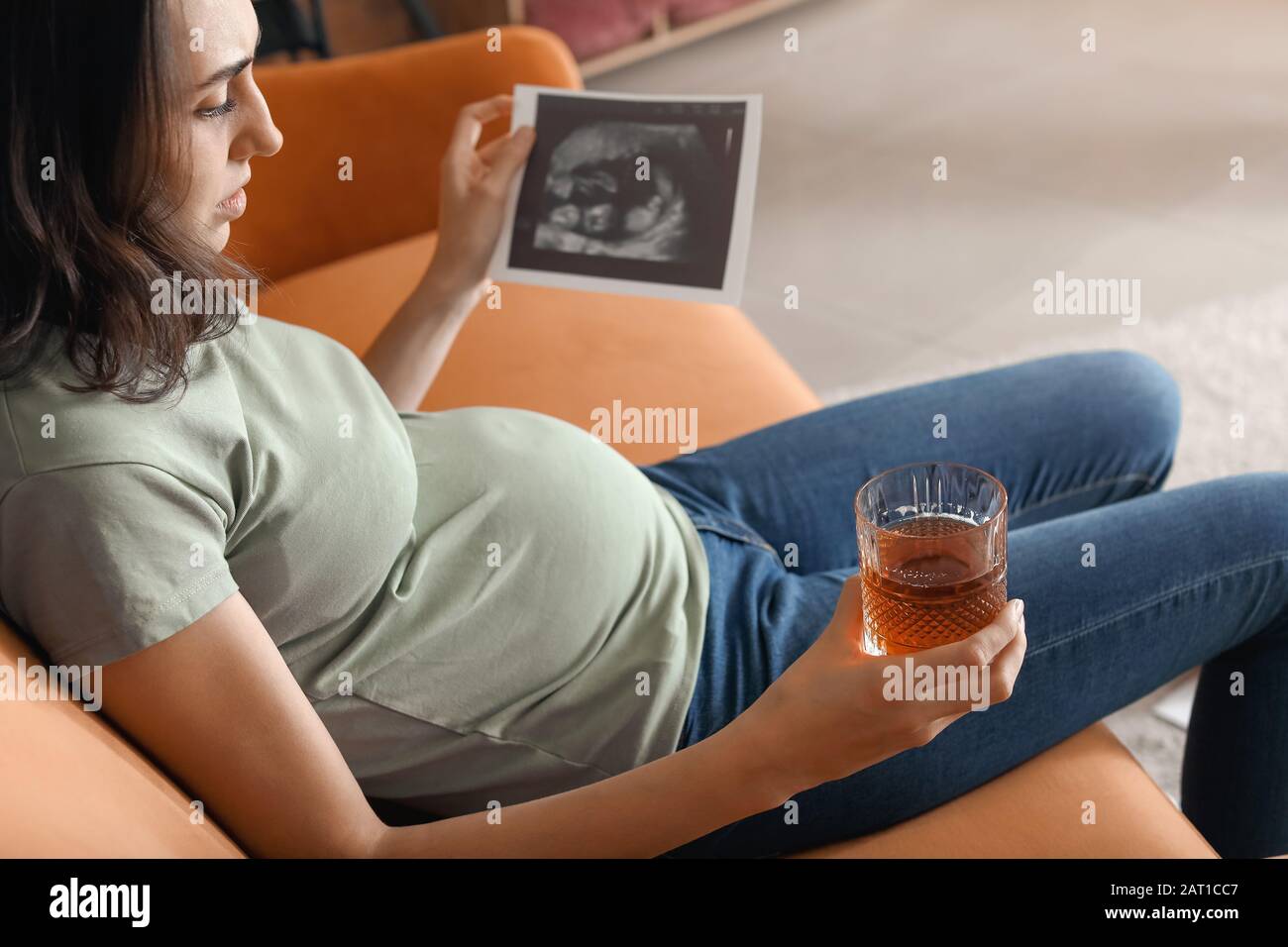 Alcohol abuse woman drinking brandy hires stock photography and images