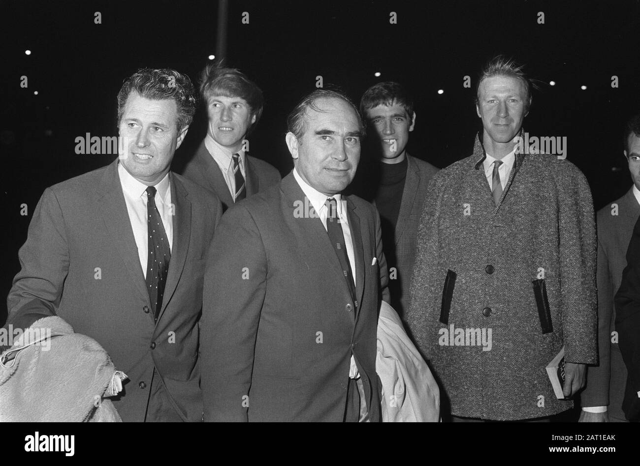 English football team arrives at Schiphol for the match against Dutch team next Wednesday. Number 11 Left Burgwal, right A. Ramsey/Date: 3 November 1969 Location: Noord-Holland, Schiphol Keywords: sport, football Personal name: A. Ramsey Stock Photo