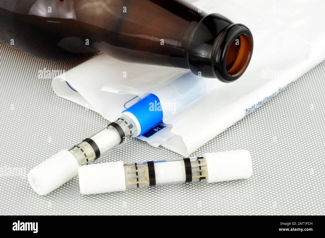 Two self test alcohol breathalysers on a metallic background Stock Photo