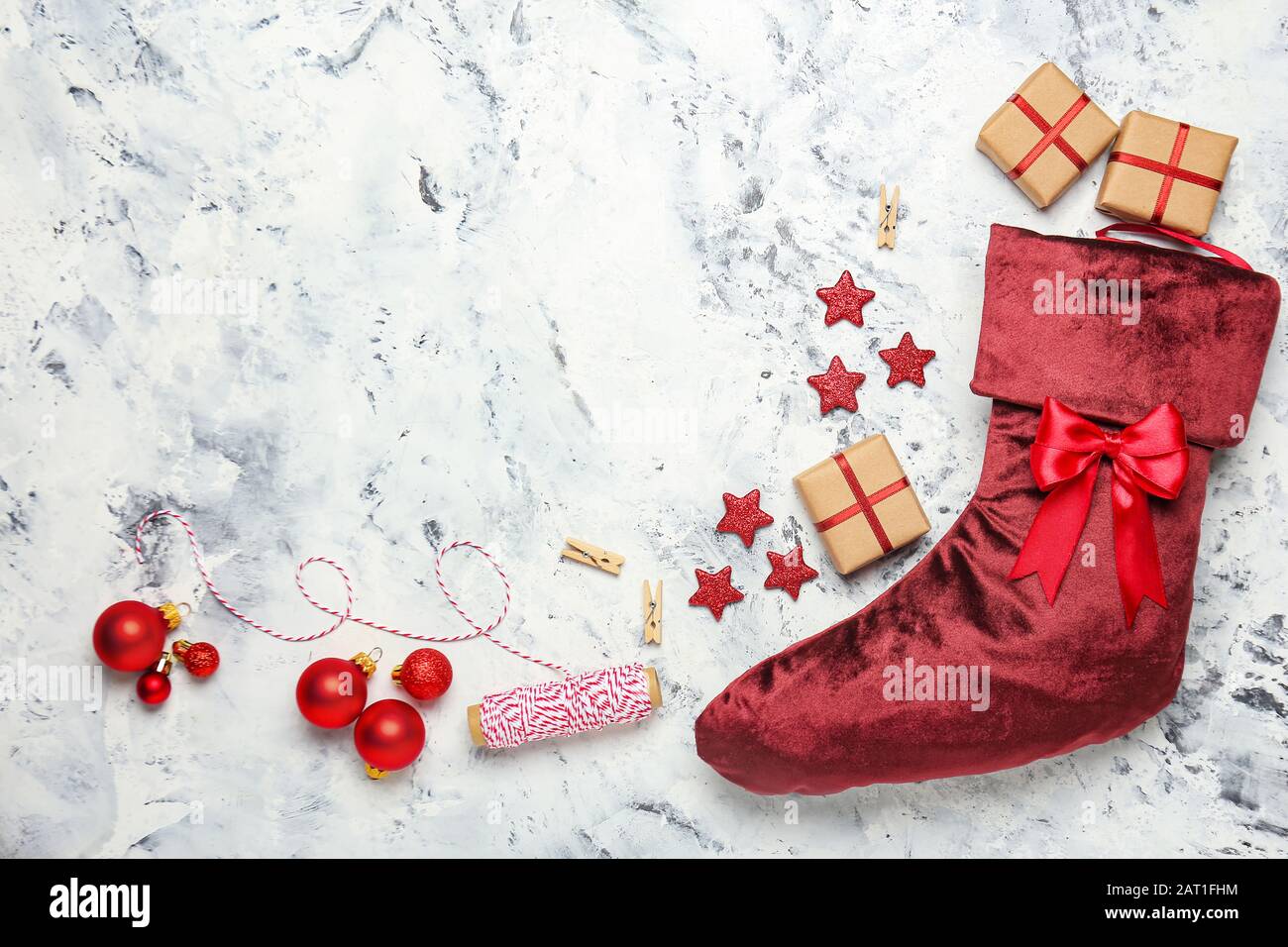 Christmas sock with gifts on white background Stock Photo Alamy