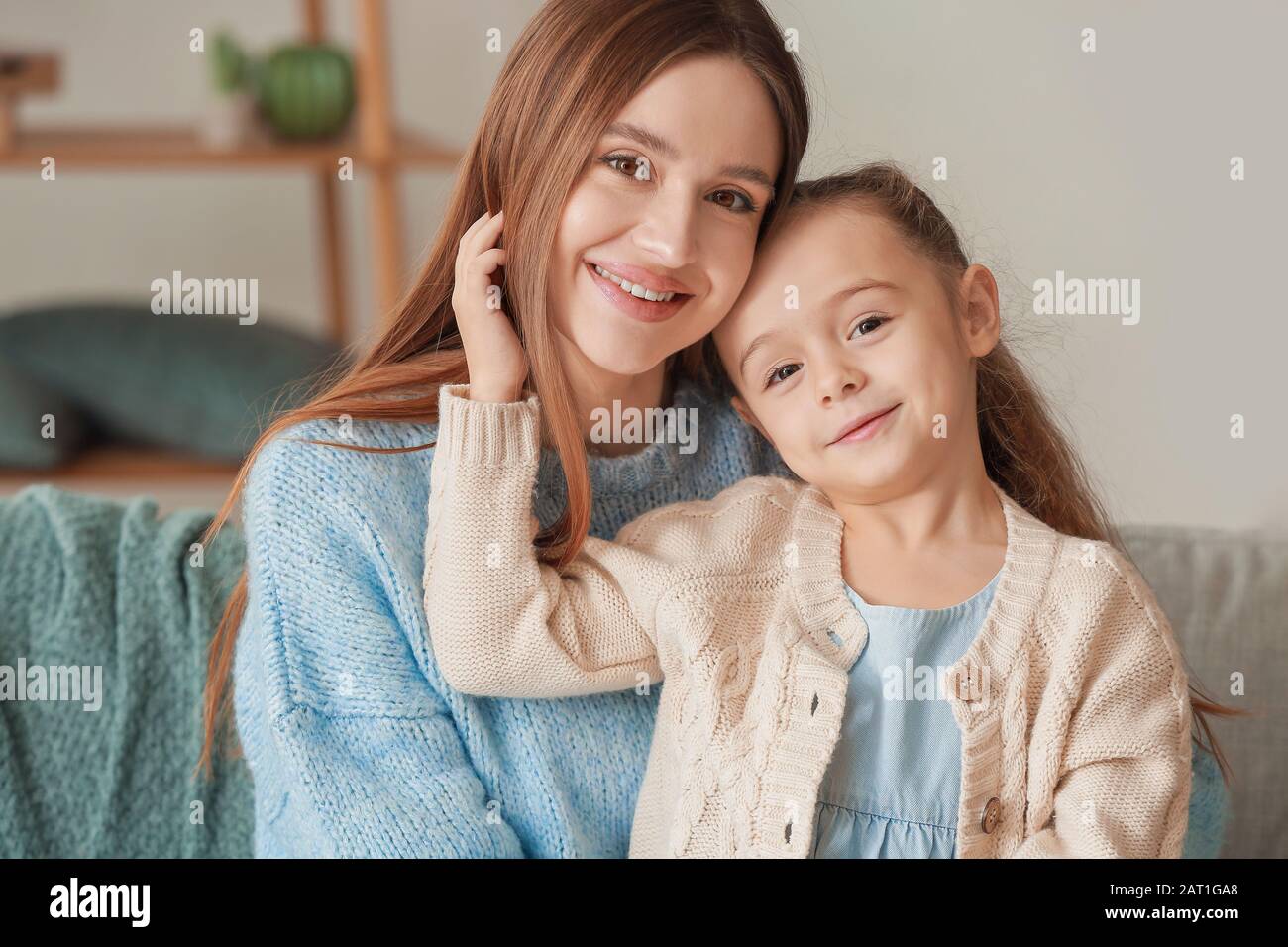 Little girl and mother spending time together at home Stock Photo
