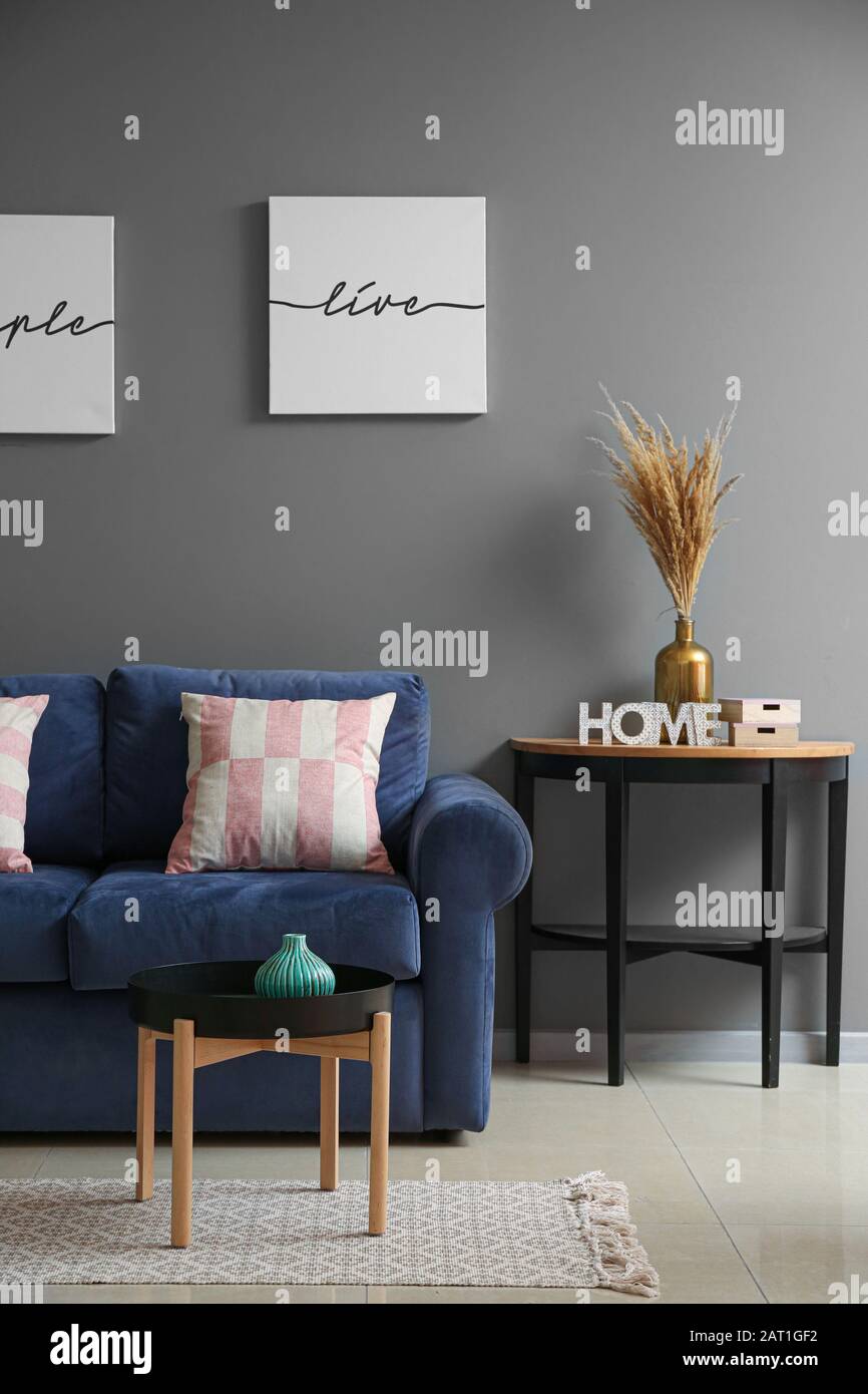 Interior of modern room with comfortable sofa Stock Photo - Alamy