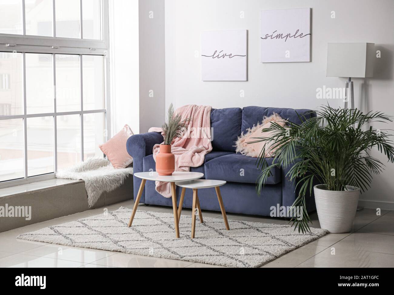 Interior of modern room with comfortable sofa Stock Photo - Alamy