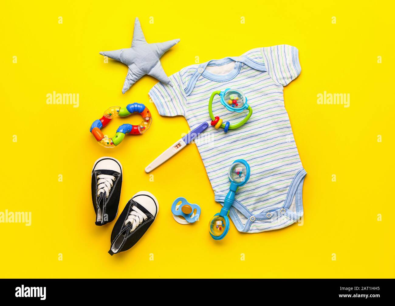 Pregnancy test, baby clothes and toys on color background Stock ... Pregnancy test, baby clothes and toys on color background Stock ...