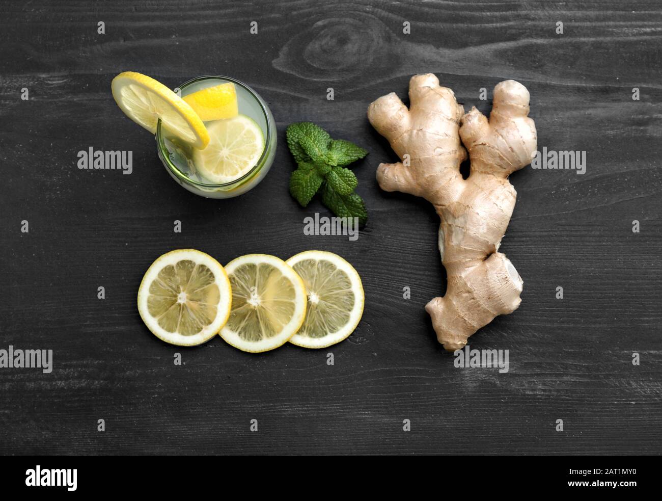 Composition with tasty ginger lemonade on wooden background Stock Photo