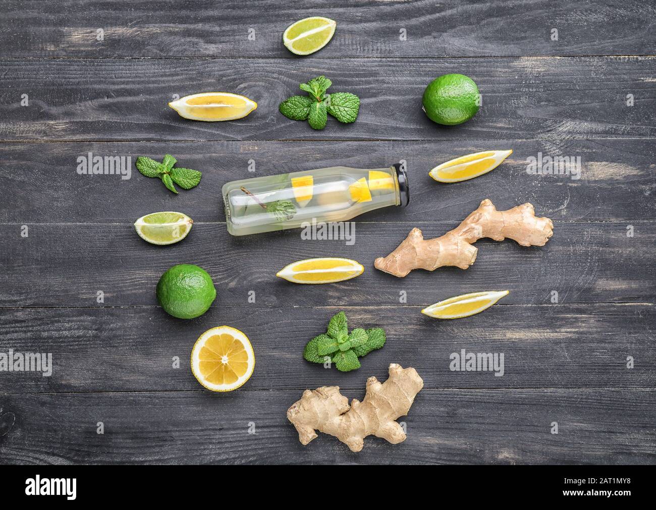 Composition with tasty ginger lemonade on wooden background Stock Photo