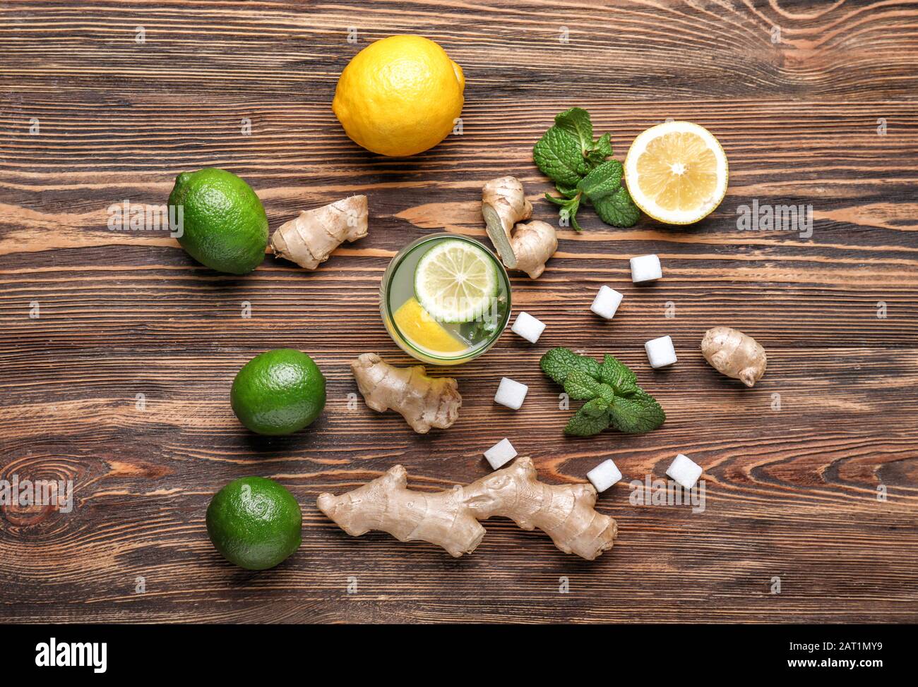 Composition with tasty ginger lemonade on wooden background Stock Photo