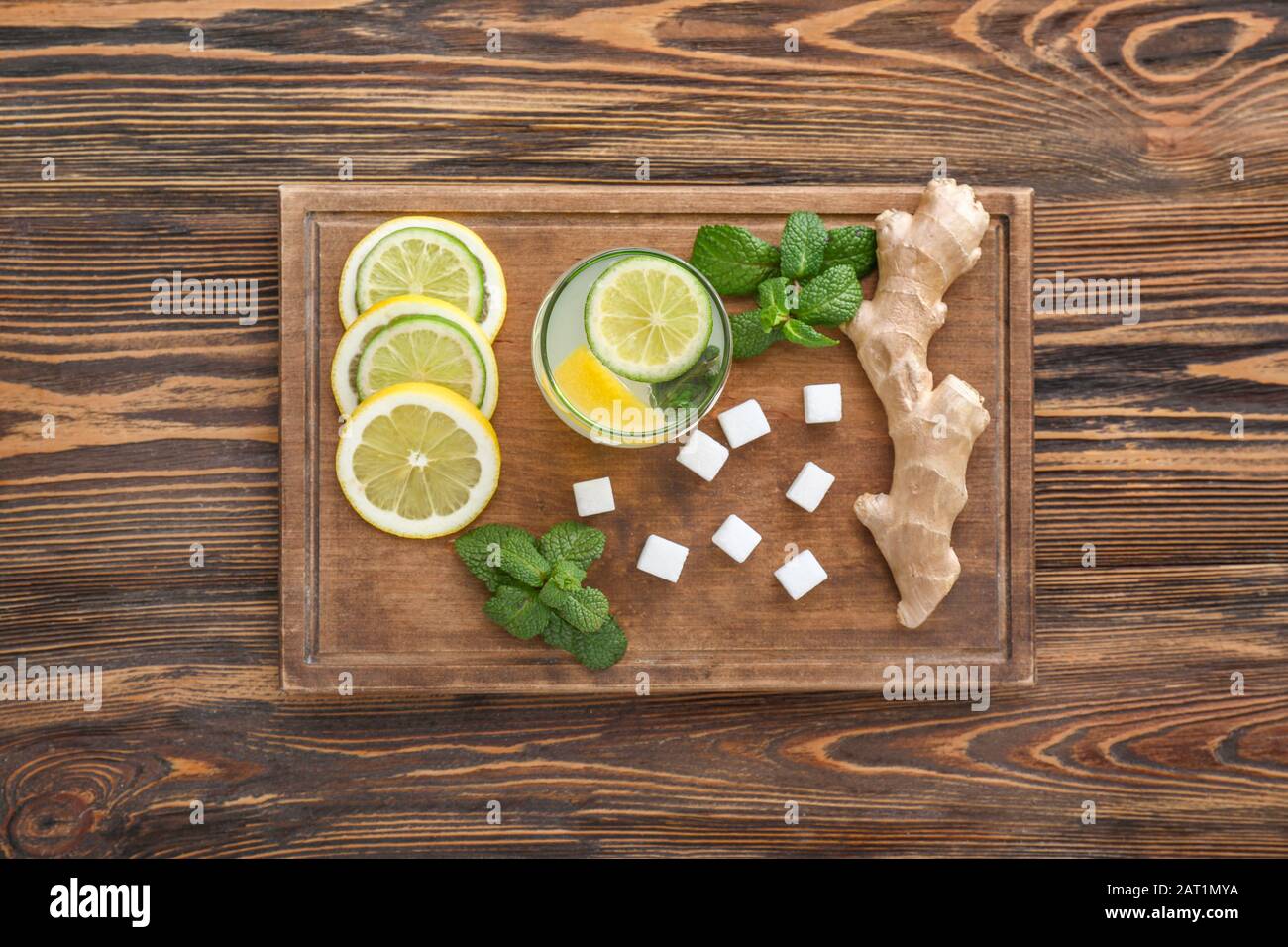 Composition with tasty ginger lemonade on wooden background Stock Photo
