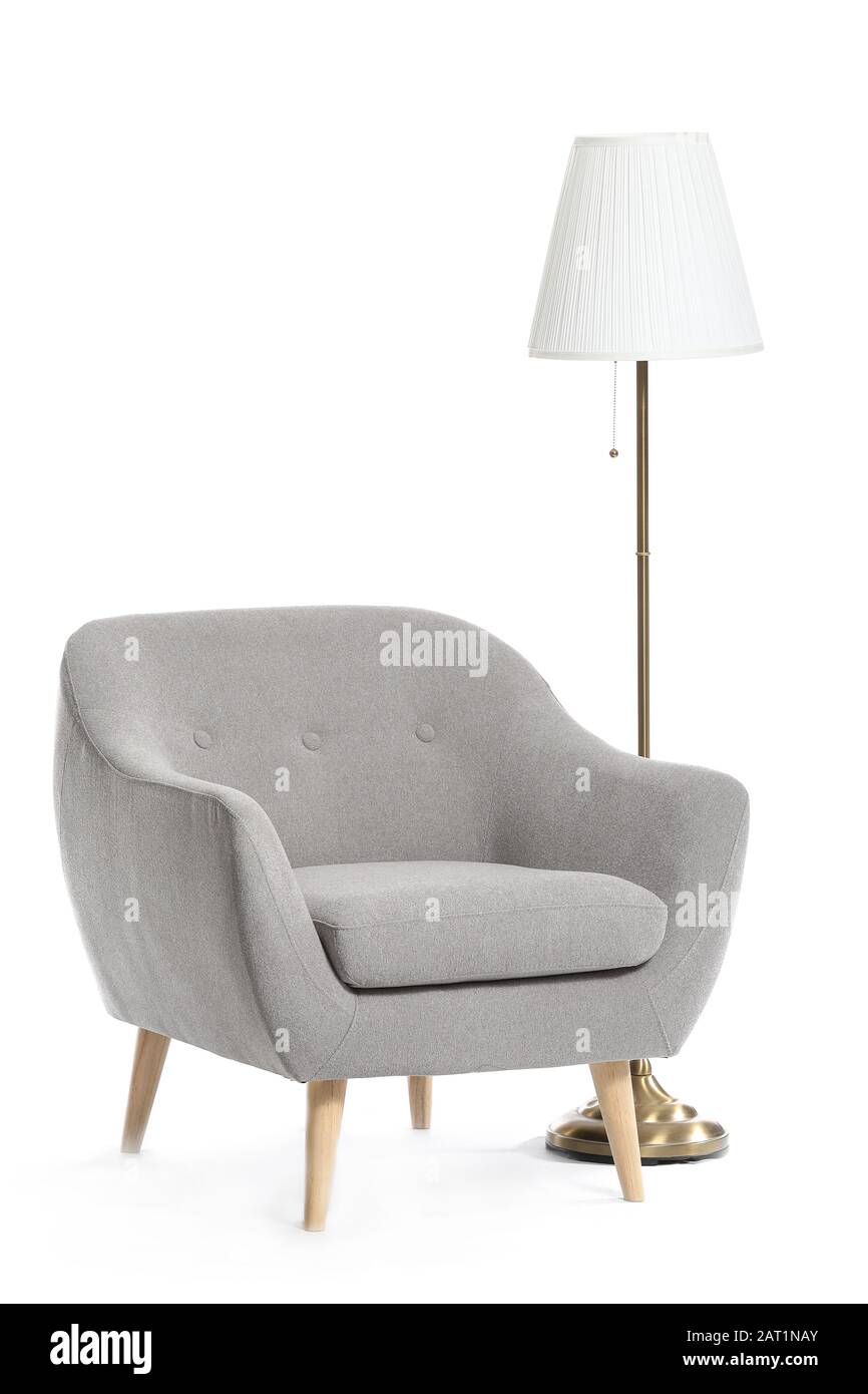Modern armchair and lamp on white background Stock Photo - Alamy