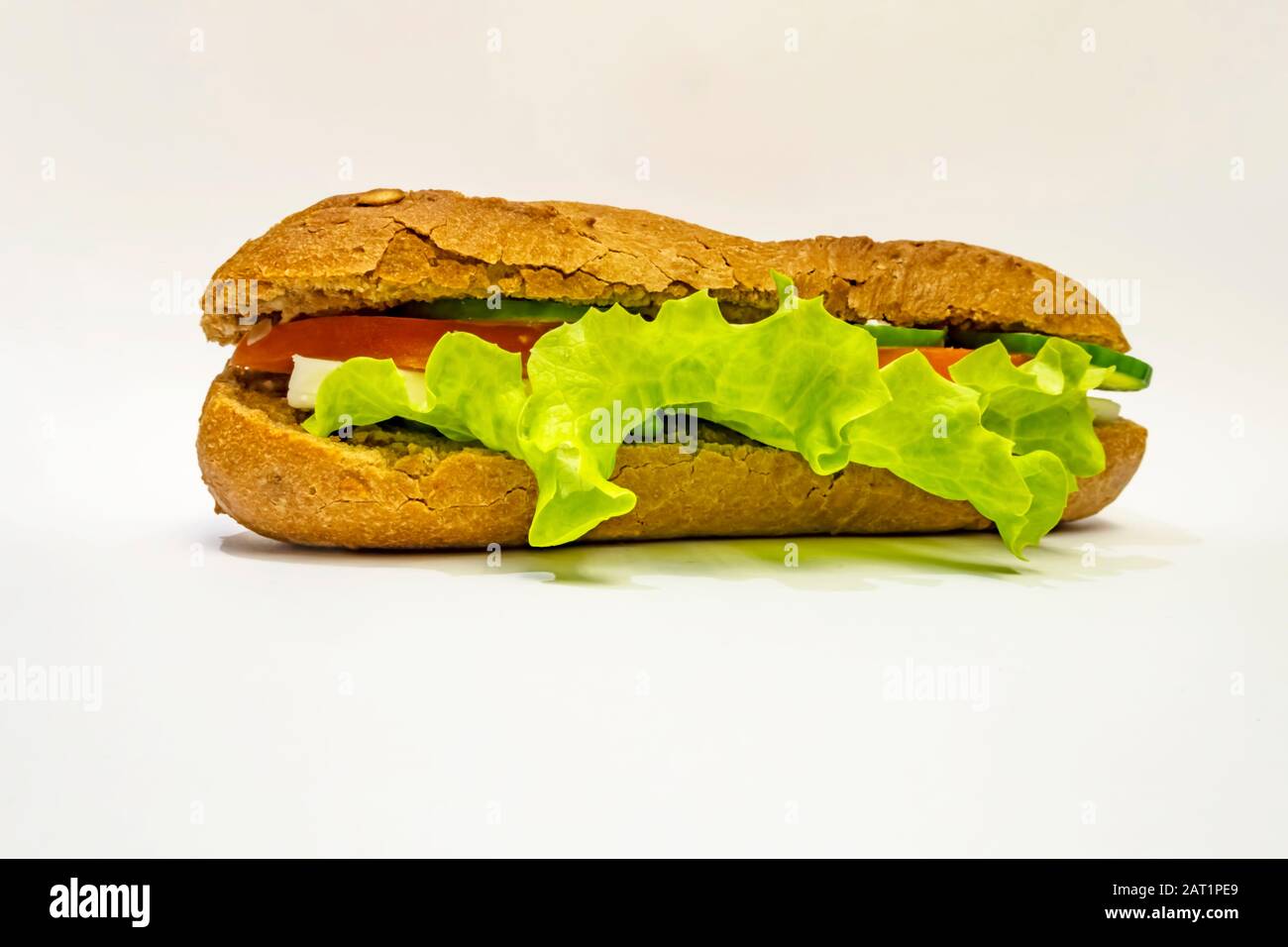 close up ready to eat sandwich with cheese, tomato, cucumber and