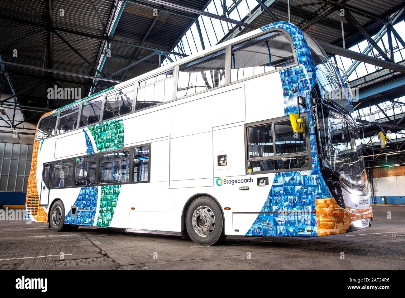 A one-of-a-kind mosaic bus livery, which features the faces of Stagecoach customers and drivers from across the UK, is unveiled to celebrate the launch of its new look bus design in its 40th year of service, at the Chesterfield depot in Derbyshire. Stock Photo