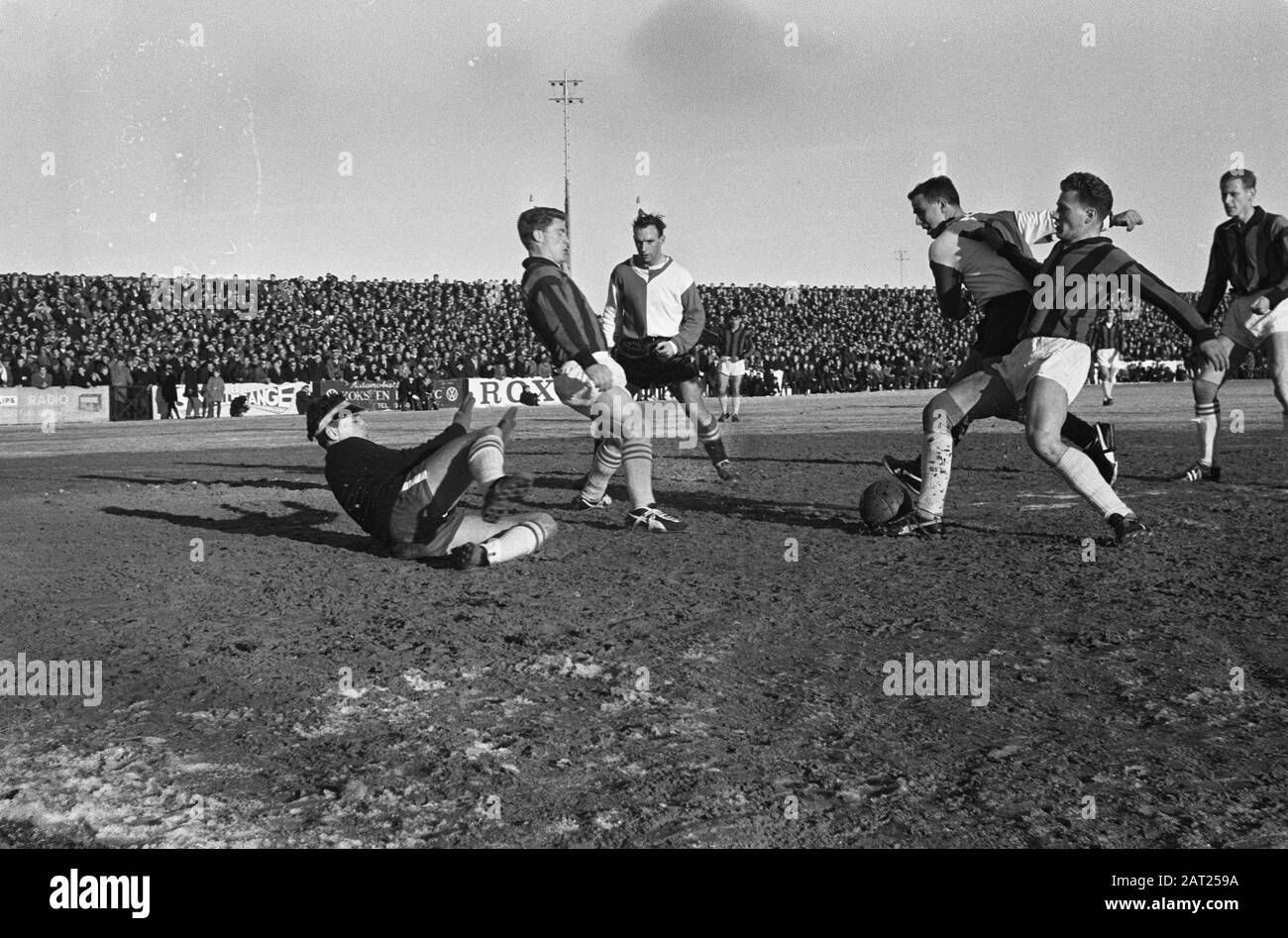 Feijenoord versus RCH, friendly at Heemstede. Van Schilden dives on shot of Bouwmeester Date: 27 January 1963 Location: Heemstede Keywords: sport, football Institution name: Feyenoord Stock Photo