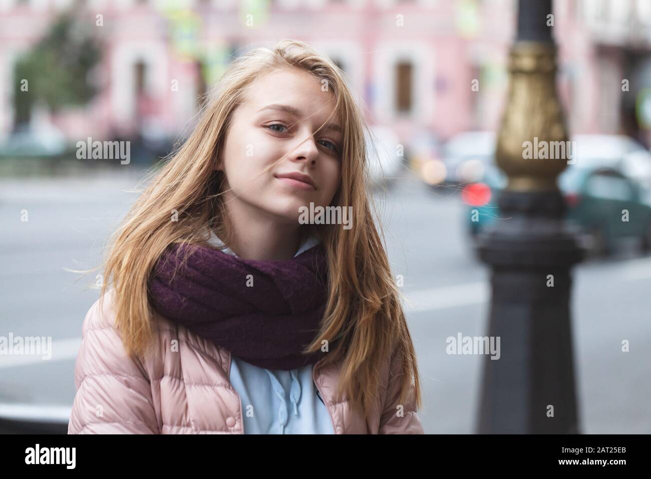 Pretty blond teenage girl on an urban walk, close up outdoor portrait, casual style Stock Photo