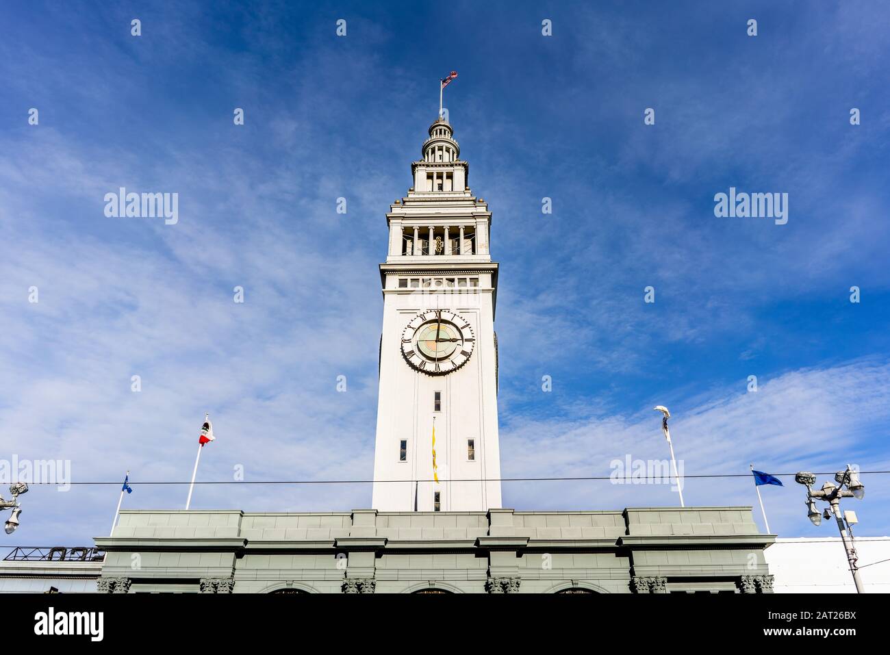 The Ferry building clock tower rising above the ferry terminal, San Francisco, California Stock Photo