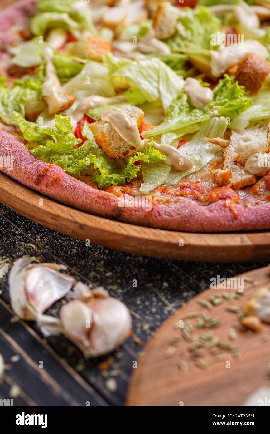 Vegetarian Pizza. Pizza With leaves of cabbage and crackers. not traditional cuisine. Stock Photo