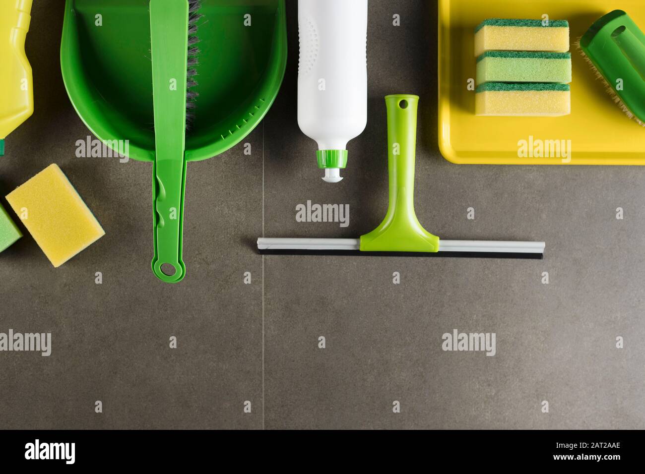Cleaning products. Home cleaning products on the gray tiles.  Place for typography. Stock Photo