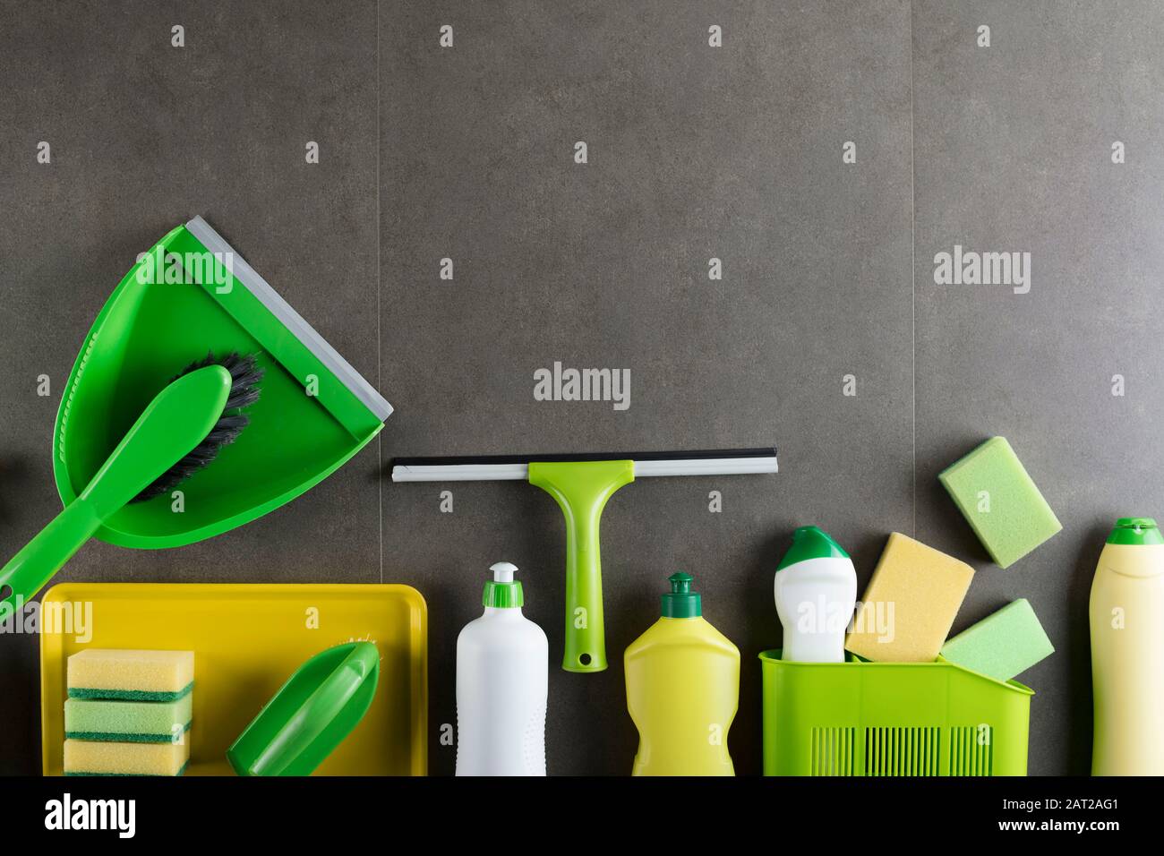 Cleaning products. Home cleaning products on the gray tiles.  Place for typography. Stock Photo
