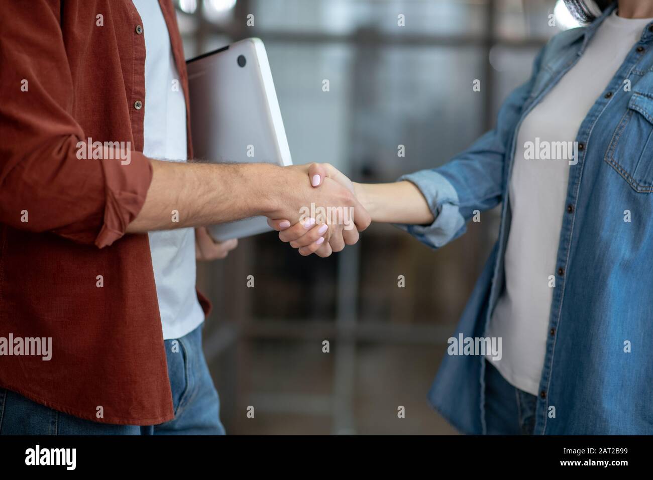 Close Up Picture Of Two People Shaking Hands Stock Photo