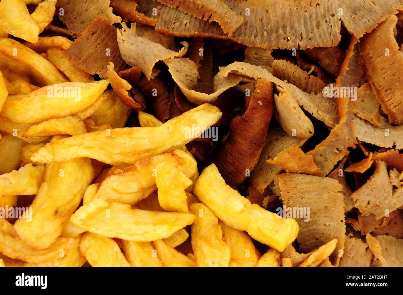 Lamb and beef gyro kebab meat slices and chips background Stock Photo