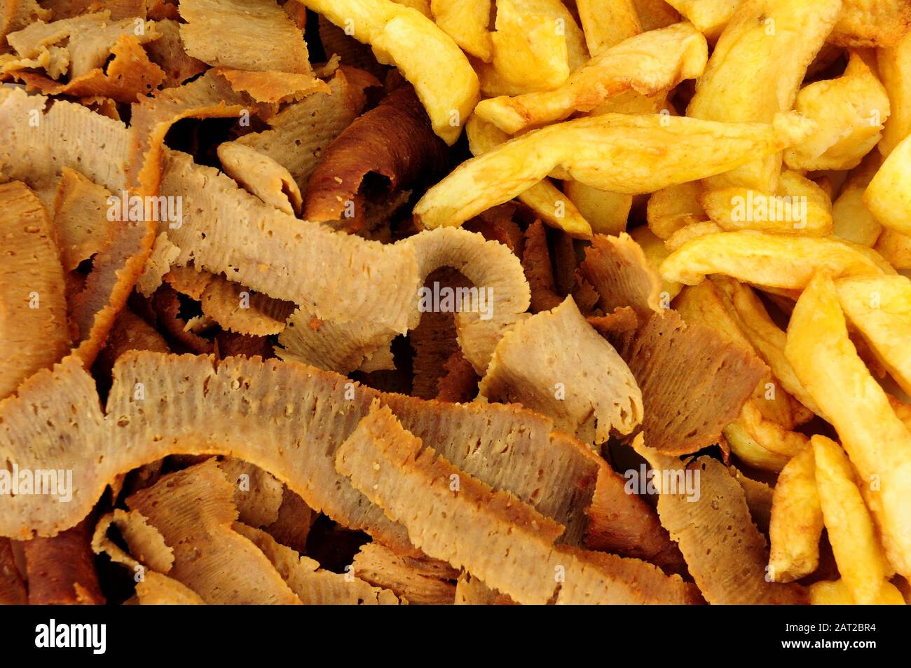 Lamb and beef gyro kebab meat slices and chips background Stock Photo