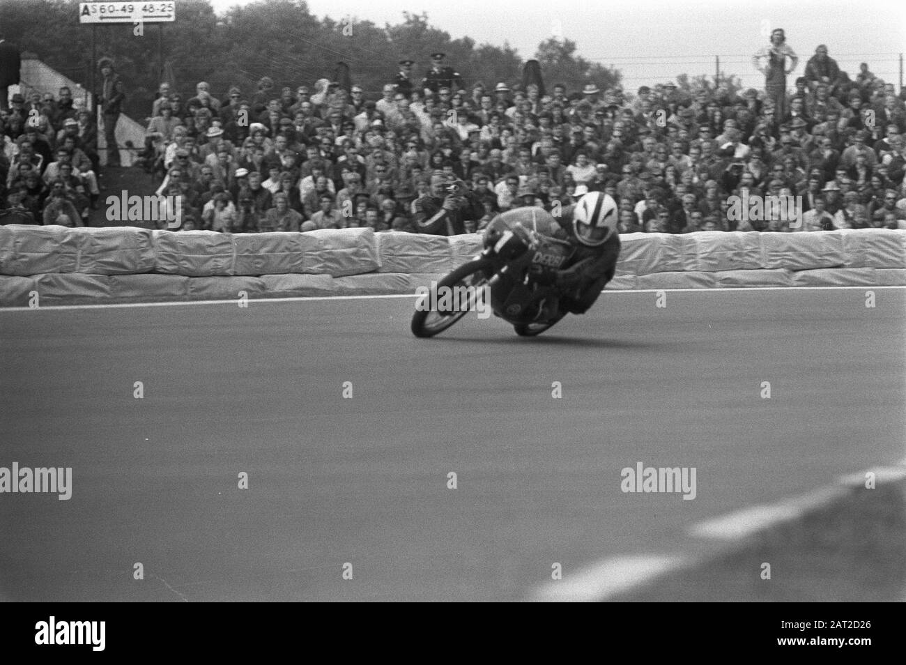 TT Assen 1972  World Champion Angel Nieto from Spain at the Derbi (also from Spain) in action in the 125cc class Date: 24 June 1972 Location: Assen, Drenthe Keywords: circuits, motorcycle drivers, motorcycles, motorsports, public, races Personal name: Nieto, Angel Stock Photo
