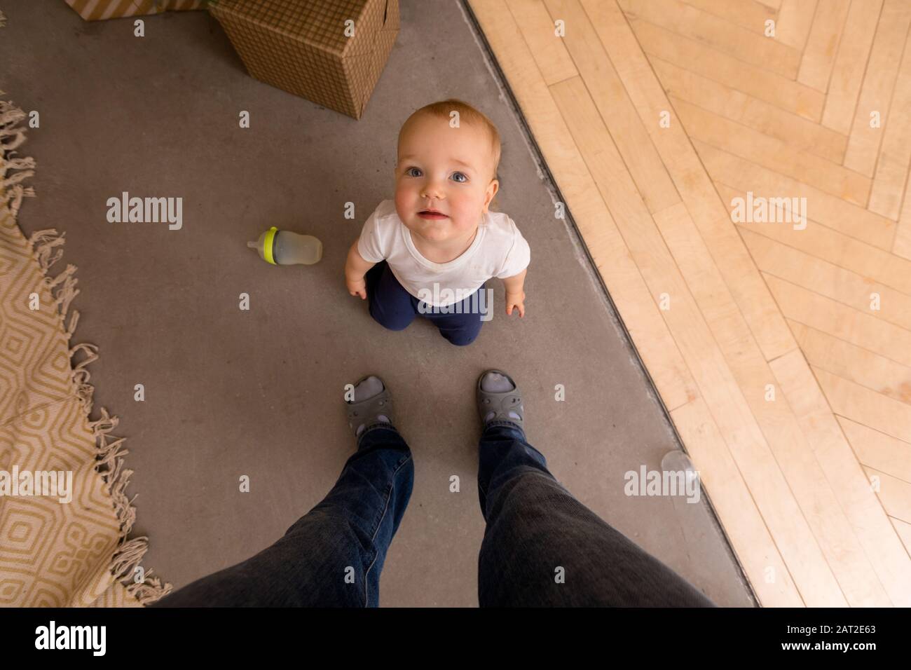 Cute toddler on floor at home Stock Photo