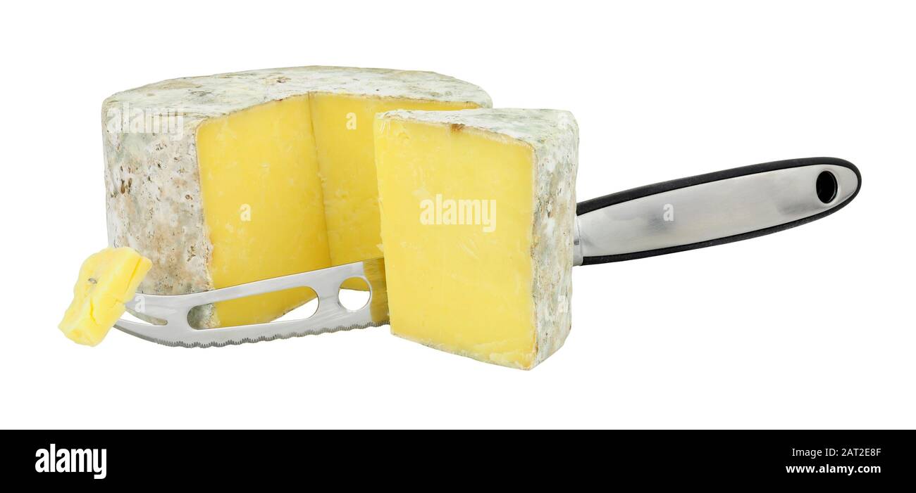 Cave aged farmhouse cheddar cheese with a cheese knife isolated on a