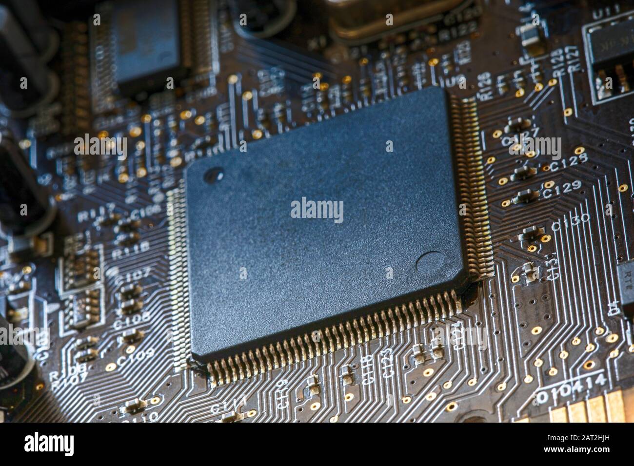 Electronic circuit board close up. Electronic computer hardware technology. PC microchip. Integrated semiconductor microprocessor Stock Photo
