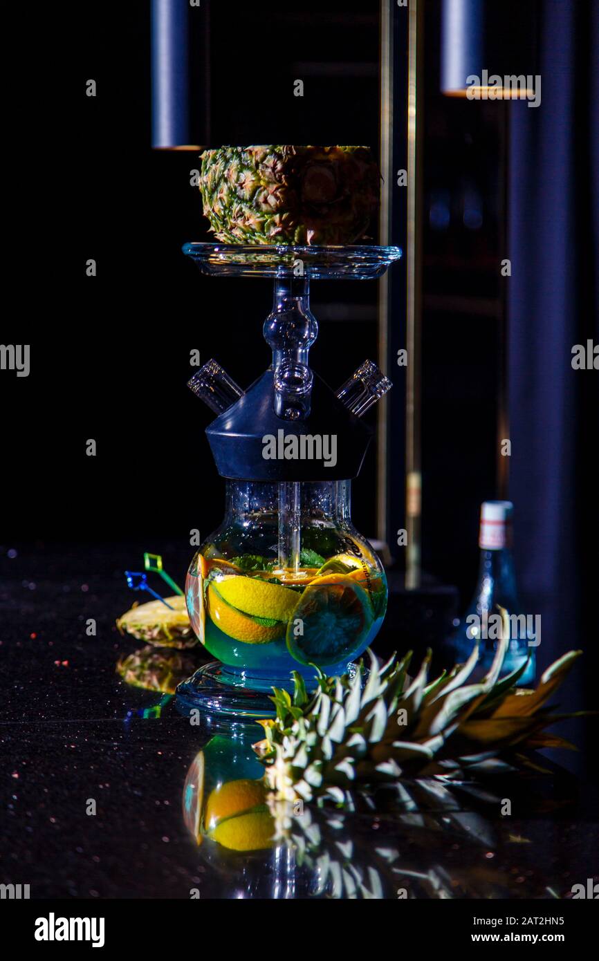 Manufacturing of hookah in the pineapple. The cut pineapple lies in the