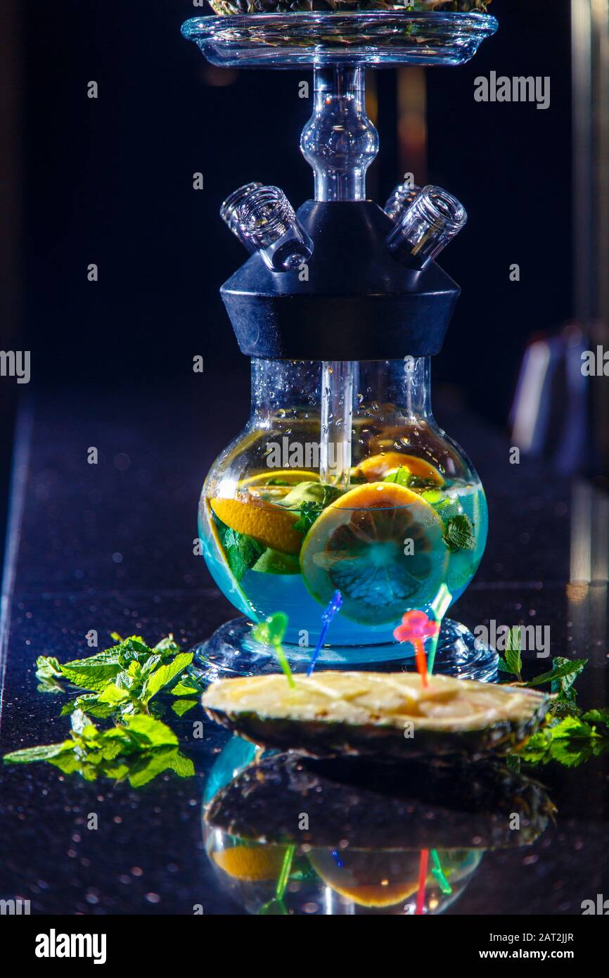 Manufacturing of hookah in the pineapple. The cut pineapple lies in the