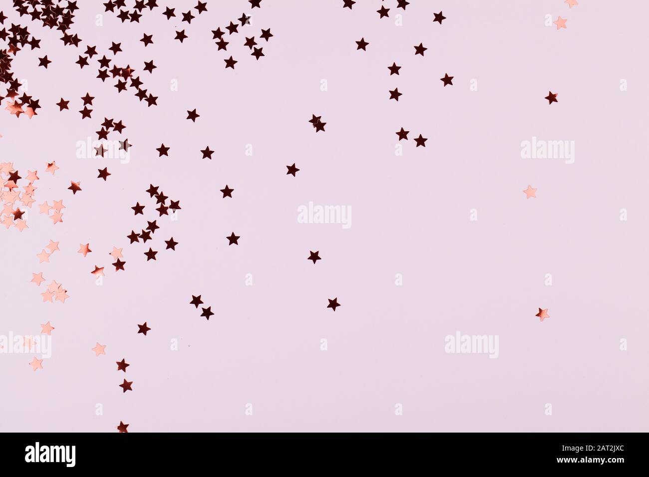 Holiday background with gold star confetti on pink background. Good ...