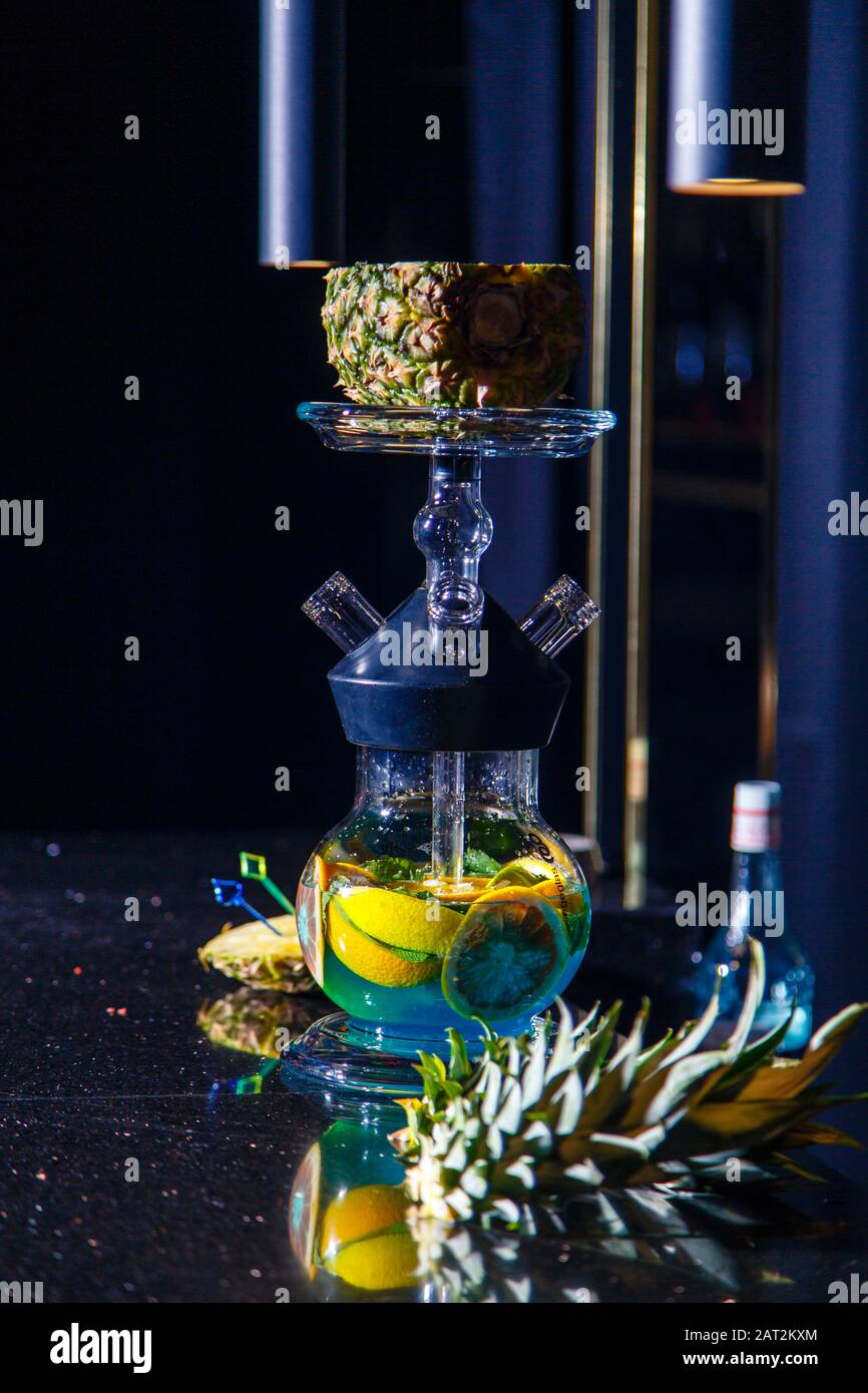 Manufacturing of hookah in the pineapple. The cut pineapple lies in the