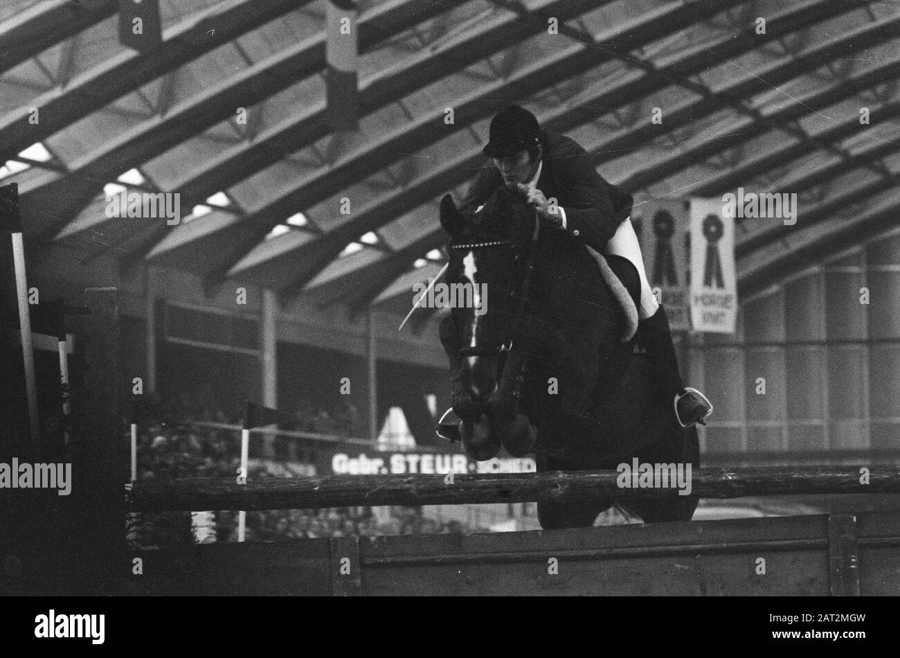 Jumping Amsterdam in RAI  Gerd Wildfang in action with Ehre Date: 4 November 1973 Location: Amsterdam, Noord-Holland Keywords: horses, riders, jumping competitions Personal name: Wildfang, G. Stock Photo