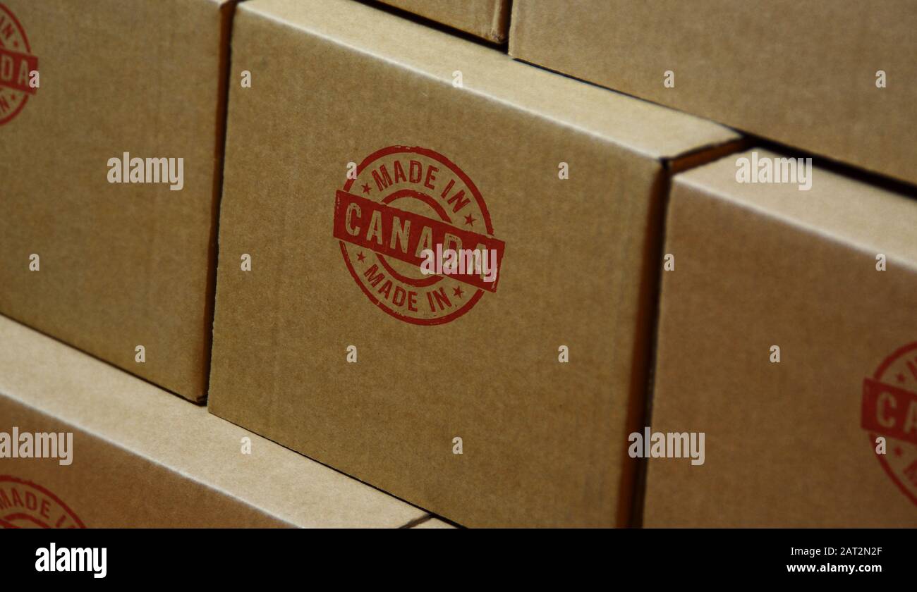 Made in Canada stamp printed on cardboard box. Factory, manufacturing and production country concept. Stock Photo