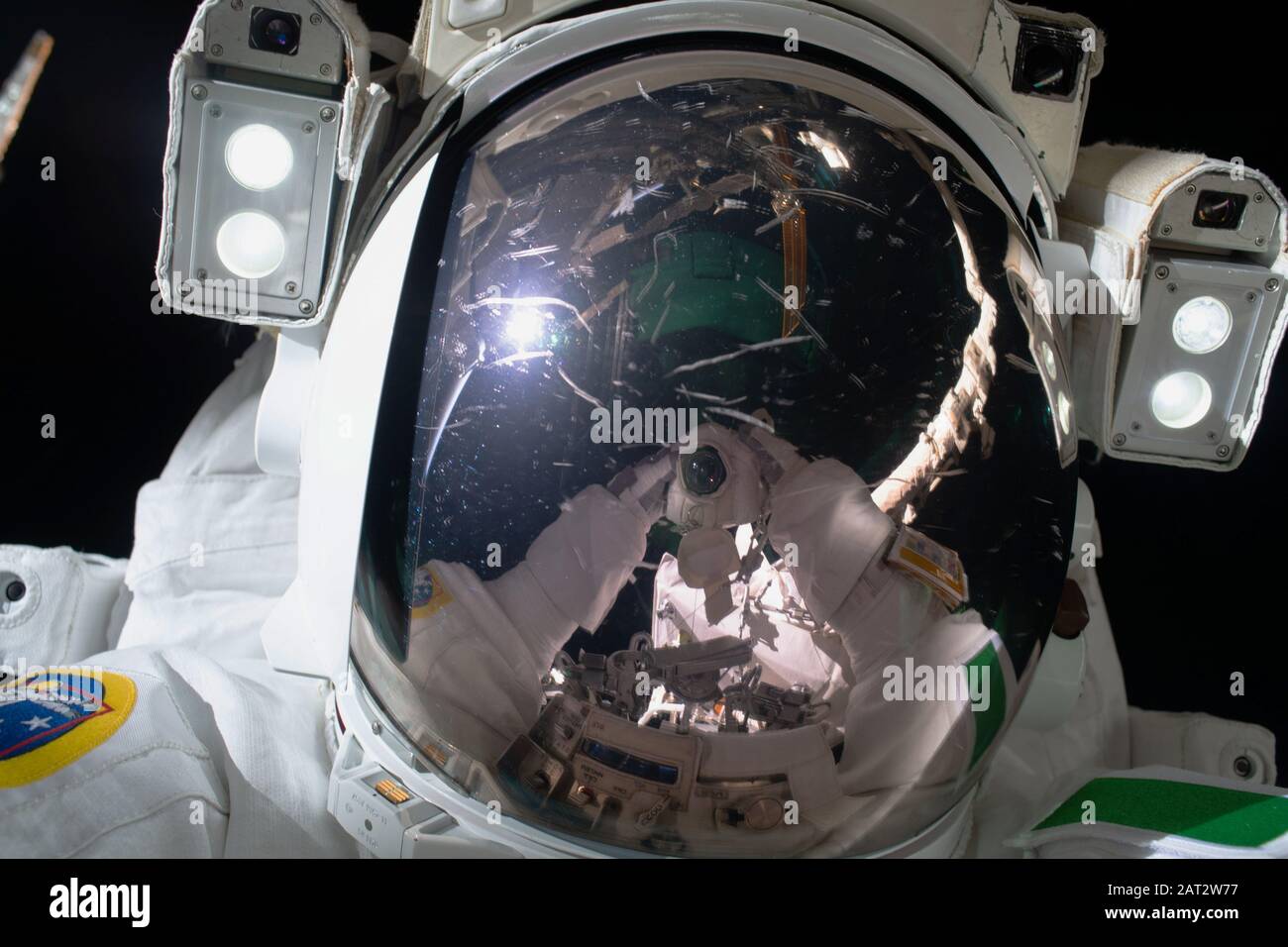 ISS - 25 Jan 2020 - ESA (European Space Agency) astronaut Luca Parmitano takes a 'space-selfie' with his camera's reflection on his spacesuit's helmet Stock Photo