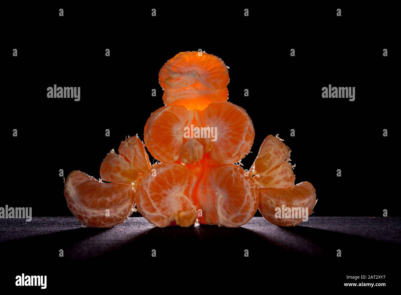 oranges tangerine,citrus reticula.on table with black background and back light still life .mandarin variety orange contains pomelo and c vitamin. Stock Photo