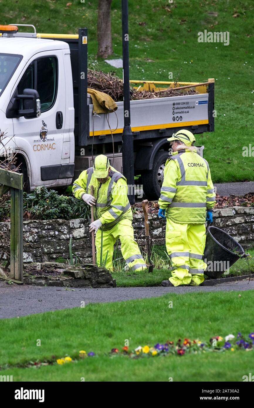 Cormac ground maintenance workers clearing the stream flowing through Trenance Gardens in Newquay in Cornwall. Stock Photo