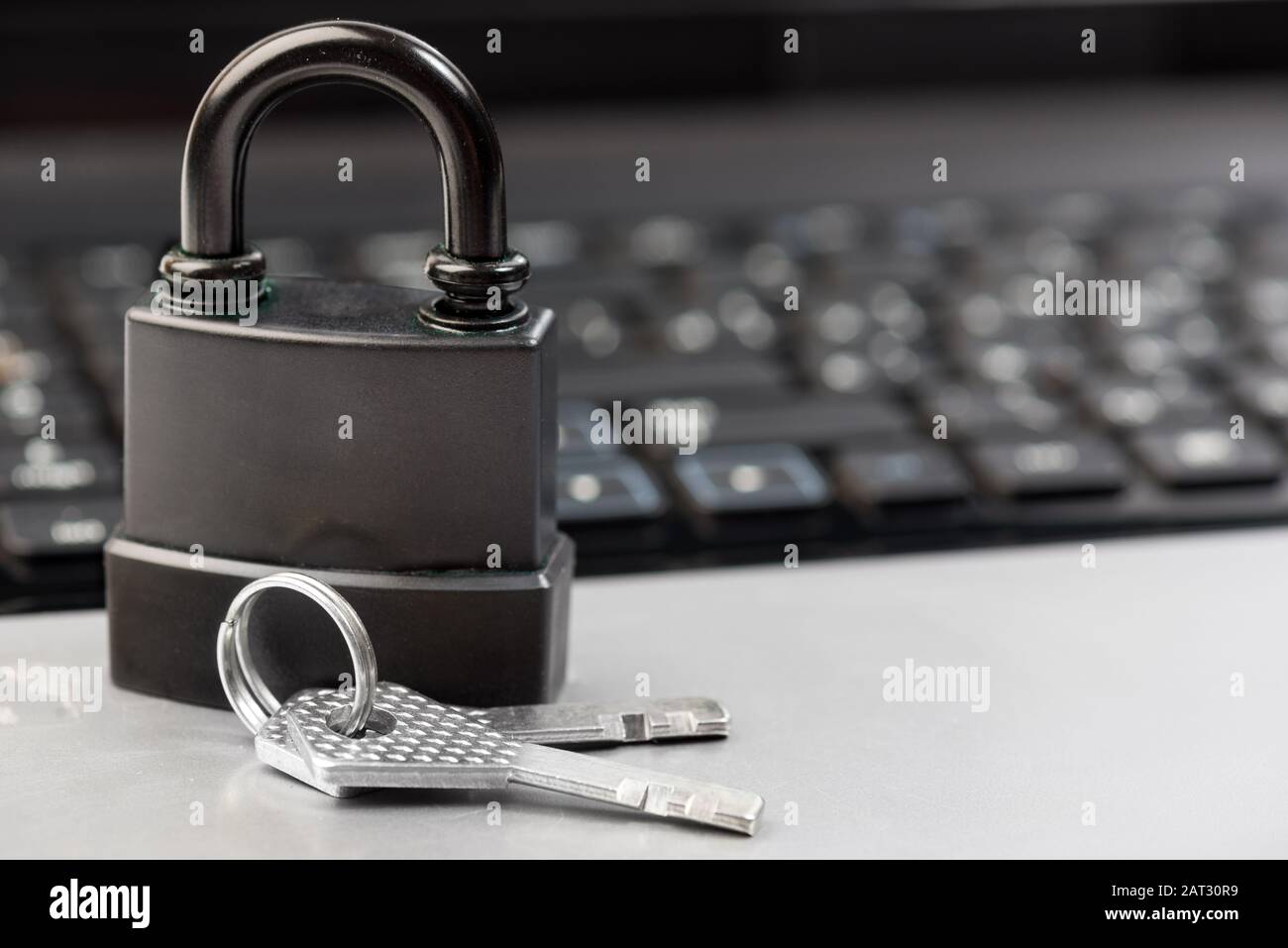 Computer security concept with a padlock on a keyboard Stock Photo