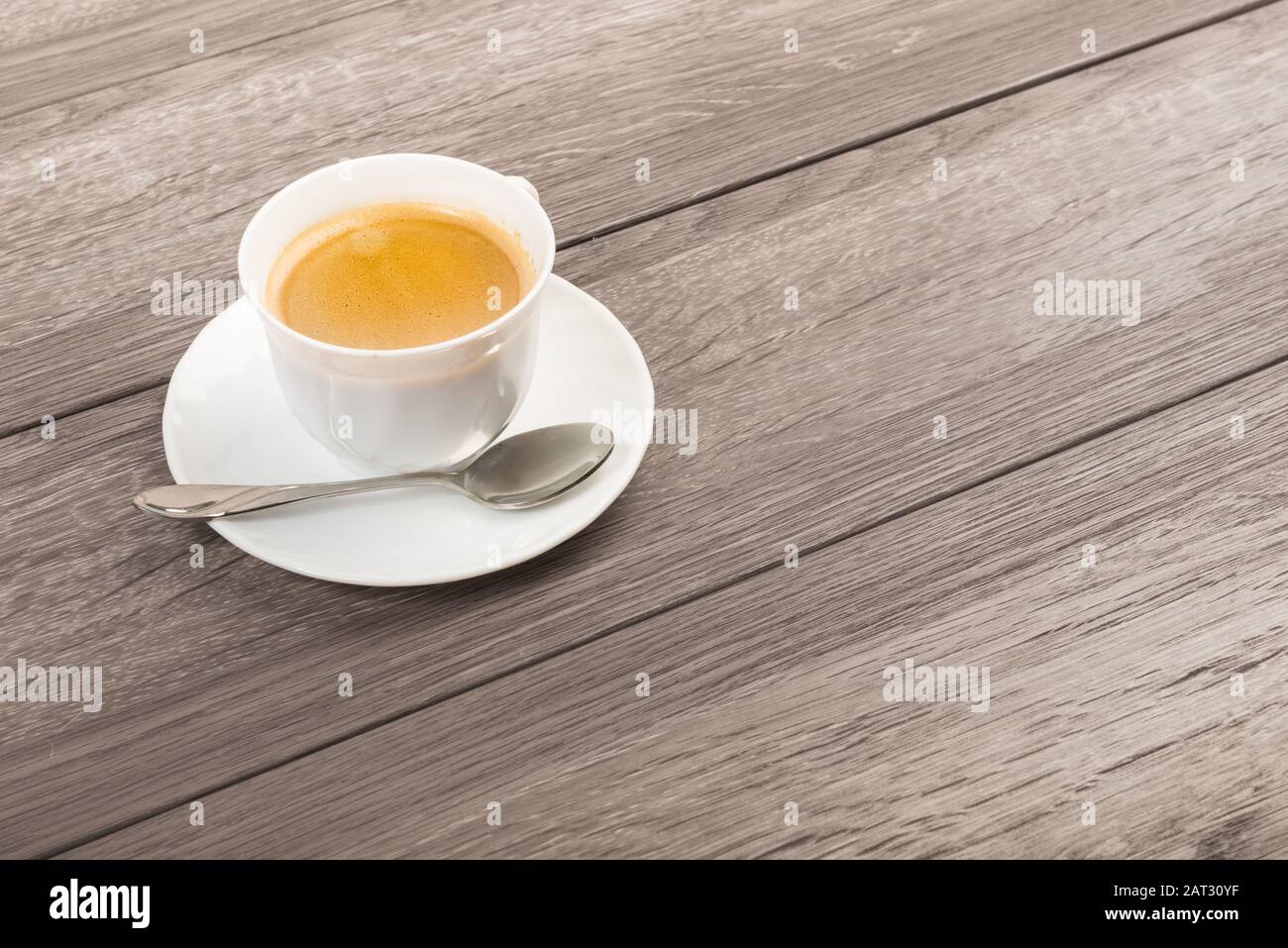 Coffee Cup on Wooden Table with copy space Stock Photo