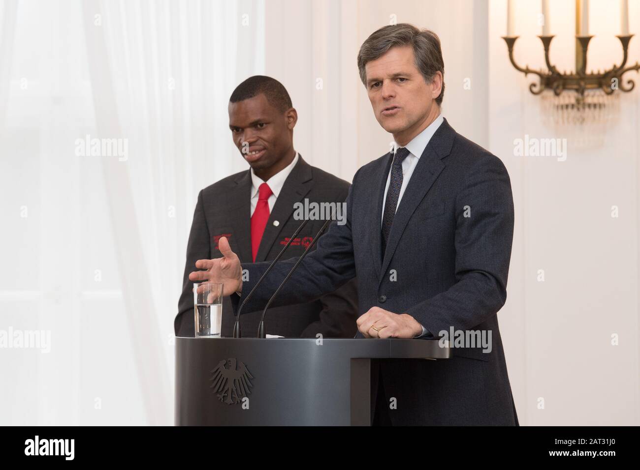 Berlin, Germany. 30th Jan, 2020. Nyasha Derera (l) and Timothy Shriver, Chairman Special Olympics International, speak at the signing of the contract for the 2023 Special Olympics World Games at Bellevue Castle. Special Olympics Germany and Special Olympics International sign the contract. Credit: Jörg Carstensen/dpa/Alamy Live News Stock Photo