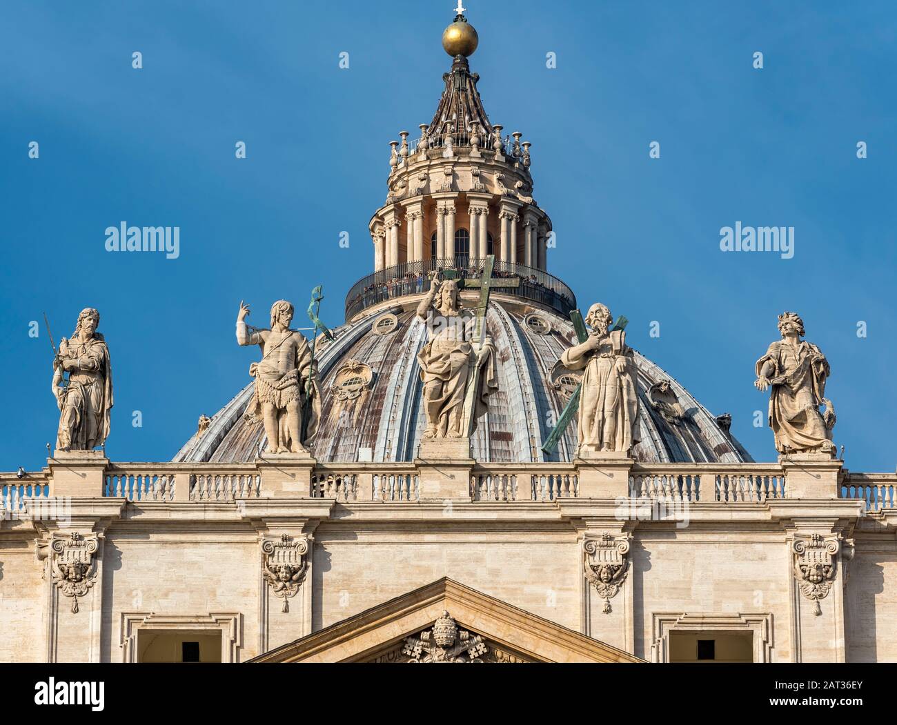 Cupola (dome) of St. Peter's Basilica with statues of Saints James