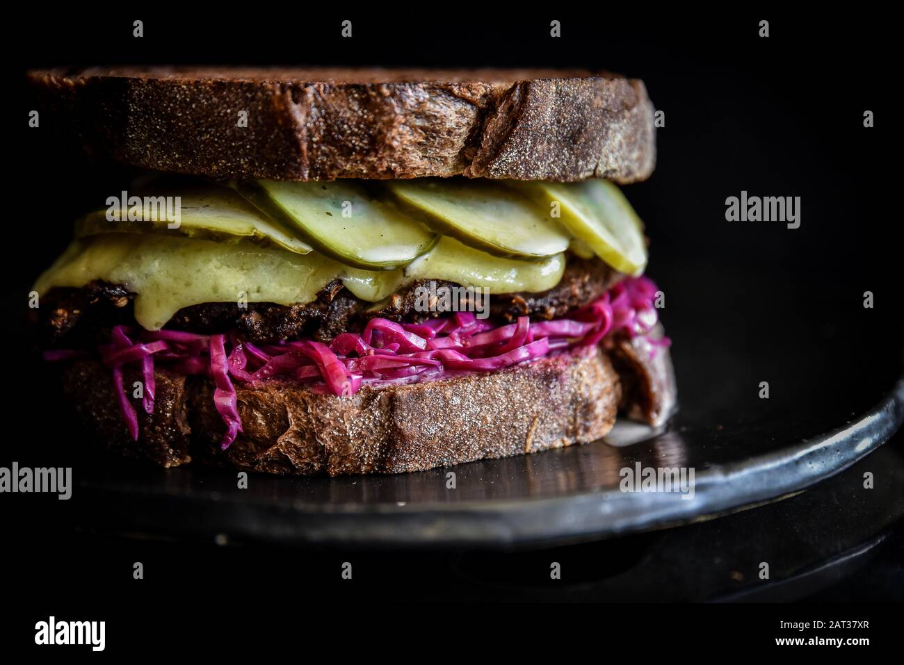 Gourmet sandwich with pickles and melted cheese Stock Photo Alamy