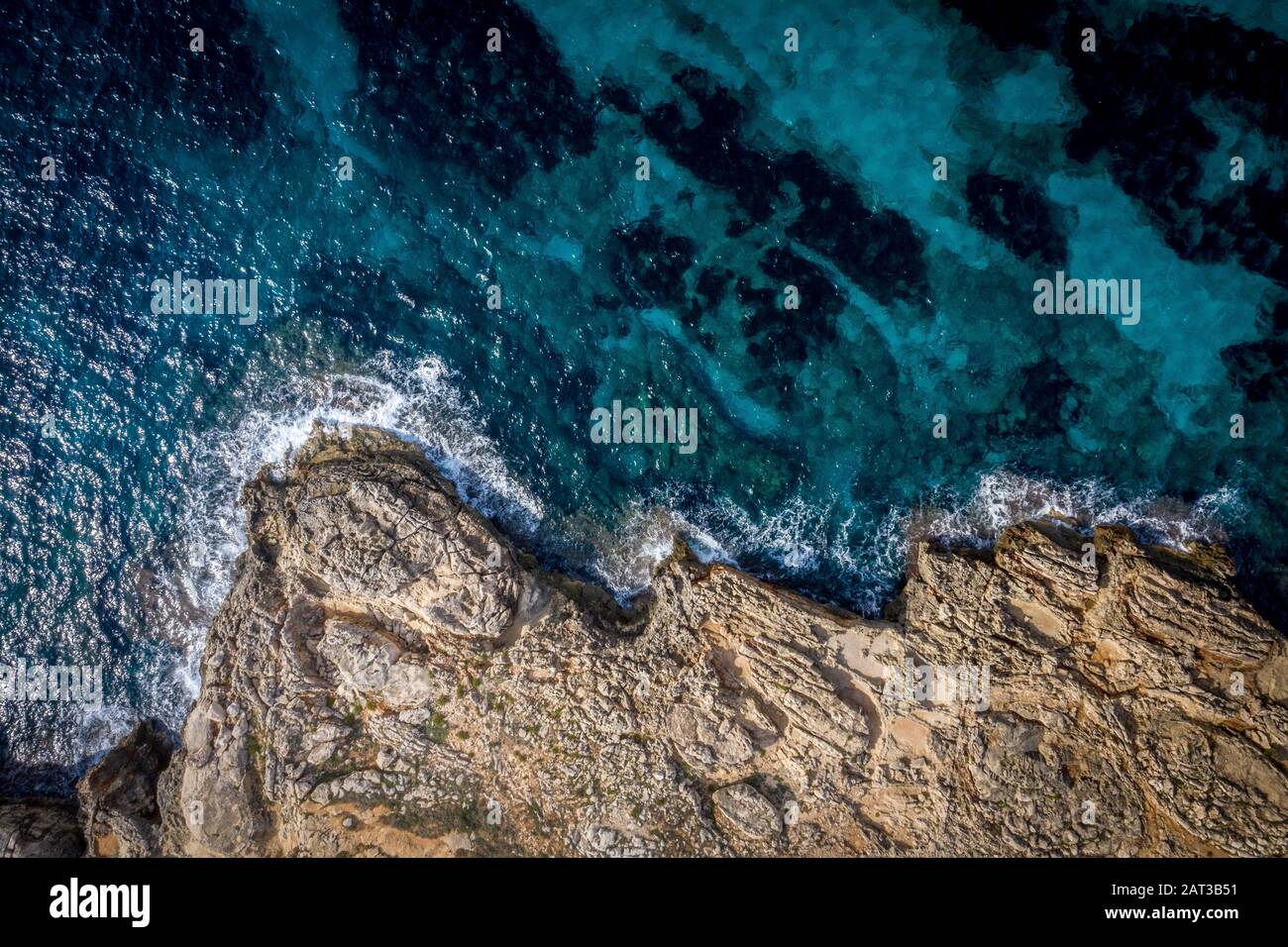Aerial above the rugged coastline Stock Photo