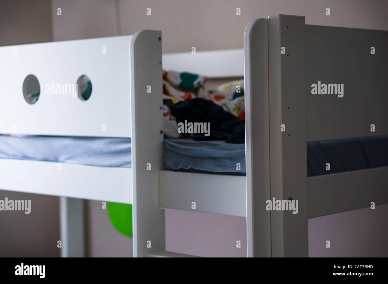 Photo of the upper part of a bunk bed with blankets Stock Photo Alamy